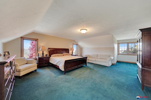 carpeted bedroom featuring lofted ceiling and a textured ceiling