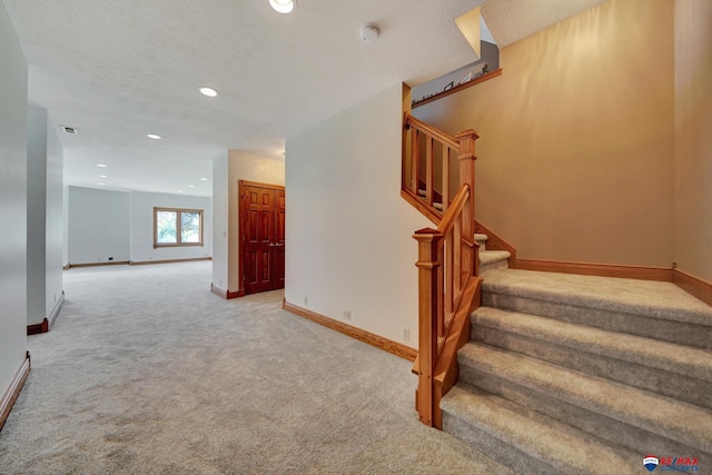 stairway with carpet flooring