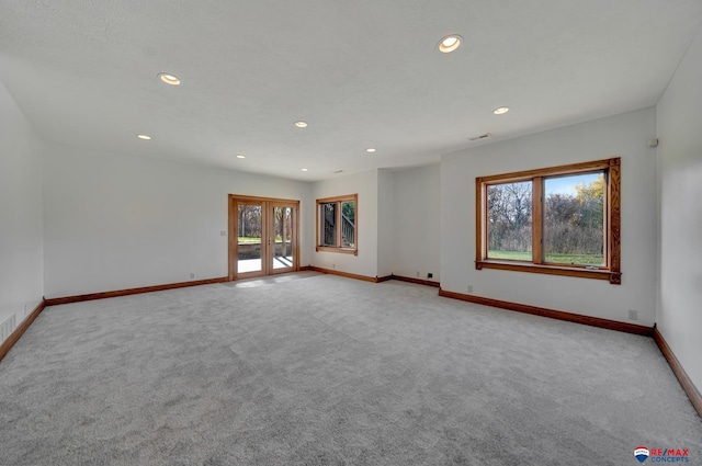 empty room featuring light carpet