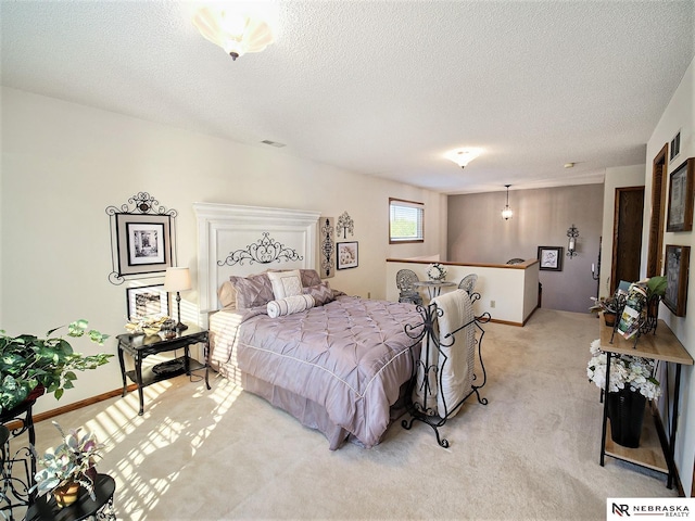 carpeted bedroom with a textured ceiling