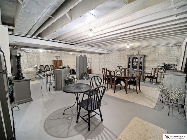 dining area with brick wall