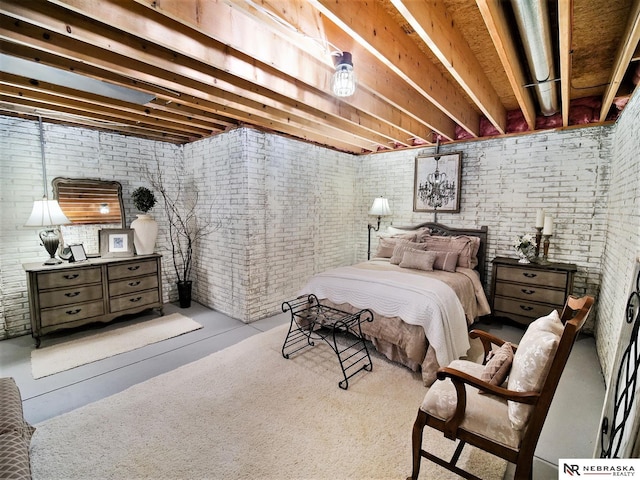 bedroom featuring brick wall