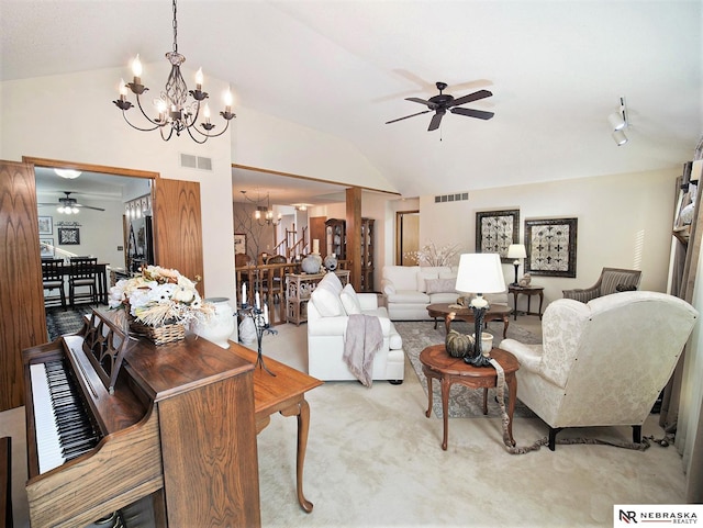 carpeted living room featuring lofted ceiling and ceiling fan with notable chandelier