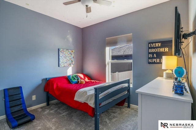 bedroom featuring dark colored carpet and ceiling fan