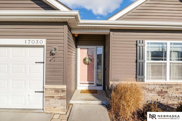 property entrance with a garage