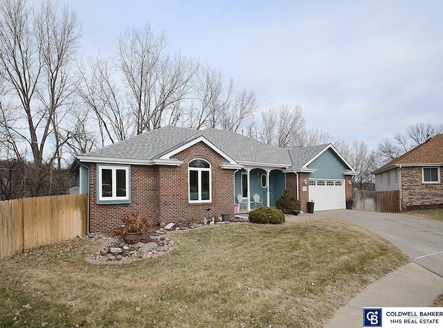 ranch-style house with a front yard and a garage