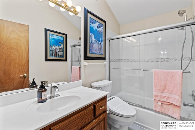 full bathroom featuring lofted ceiling, toilet, vanity, and bath / shower combo with glass door