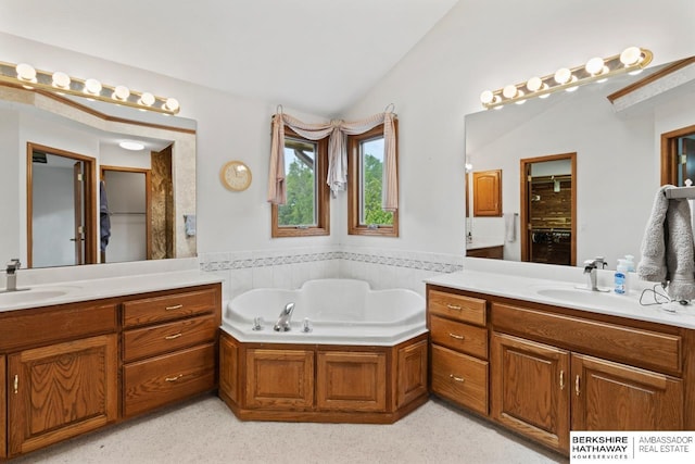 bathroom with lofted ceiling, shower with separate bathtub, and vanity