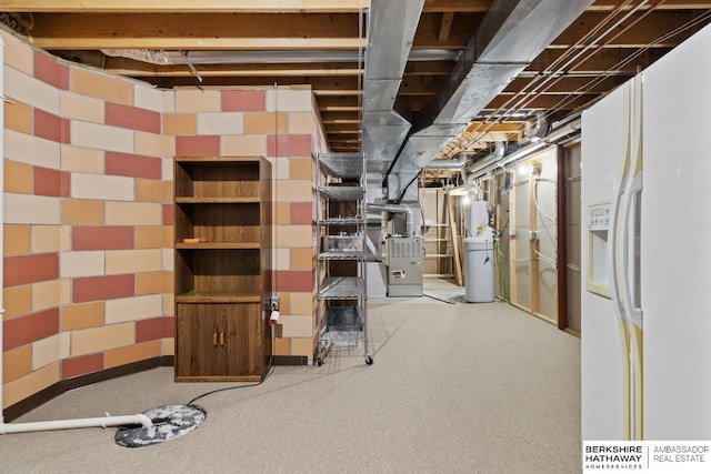 basement featuring white fridge with ice dispenser and heating unit