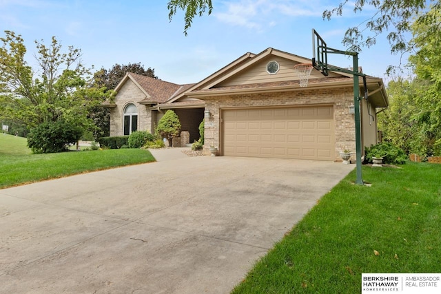 ranch-style house featuring a front yard and a garage