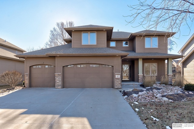 prairie-style house featuring a garage