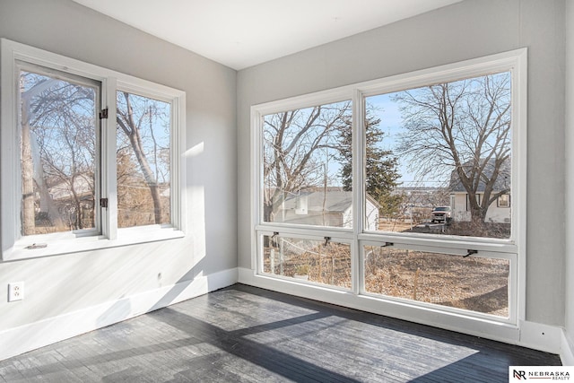 unfurnished sunroom featuring a wealth of natural light