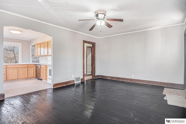 unfurnished living room with ornamental molding, ceiling fan, and dark hardwood / wood-style flooring