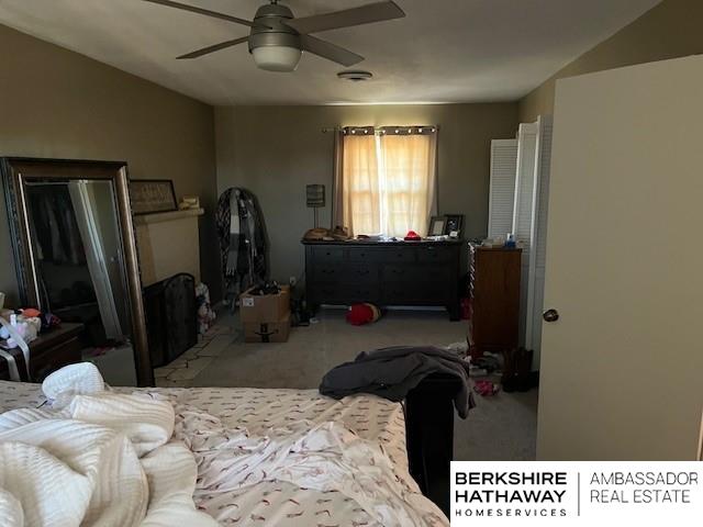 carpeted bedroom featuring ceiling fan