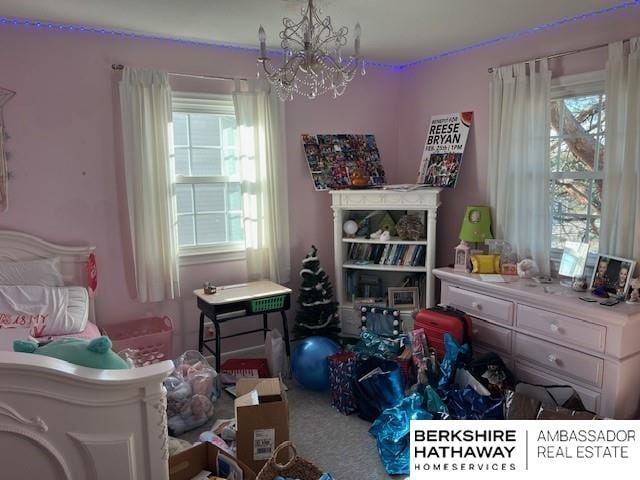 bedroom with an inviting chandelier