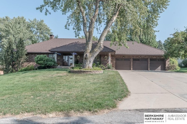 ranch-style house with a front lawn and a garage