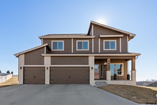 craftsman-style home featuring a garage and covered porch