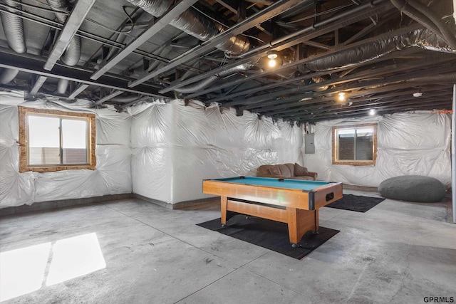 basement with pool table and electric panel