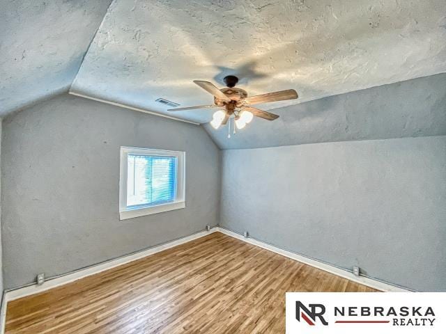 bonus room featuring lofted ceiling, ceiling fan, and light hardwood / wood-style floors