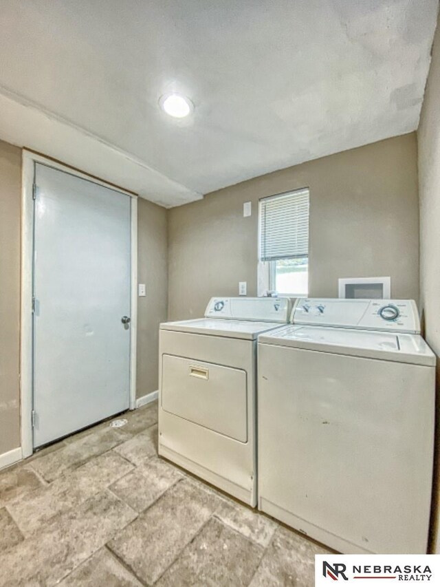 washroom with washer and clothes dryer