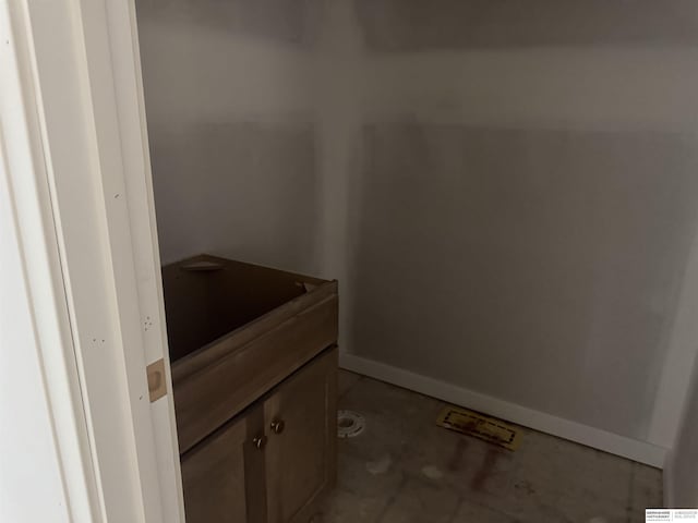 bathroom featuring baseboards and vanity