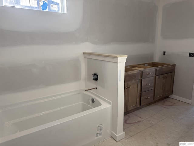 bathroom featuring vanity and a bathtub