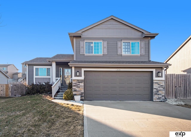 view of front facade featuring a front yard and a garage