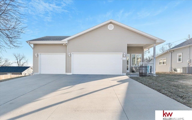 view of front of home featuring a porch and a garage