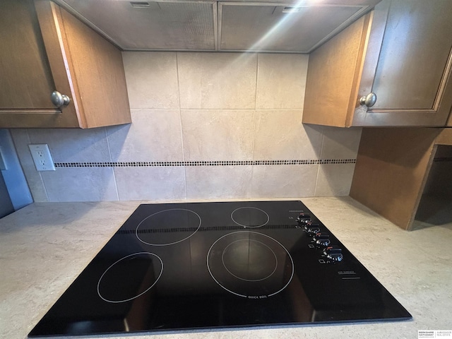 kitchen featuring black electric cooktop and extractor fan