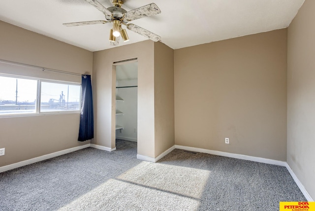 unfurnished bedroom with ceiling fan and carpet flooring