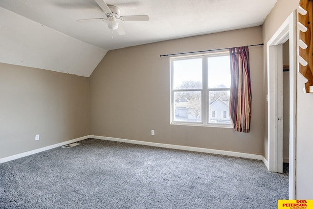 additional living space featuring carpet, ceiling fan, and vaulted ceiling