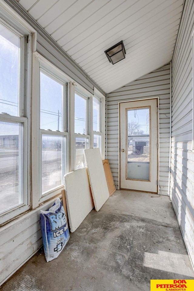 unfurnished sunroom with vaulted ceiling