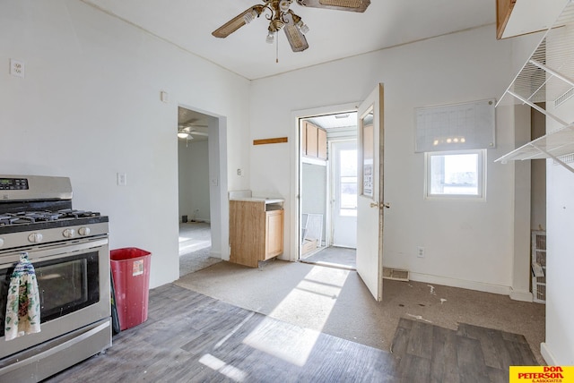 kitchen featuring ceiling fan and stainless steel range with gas cooktop