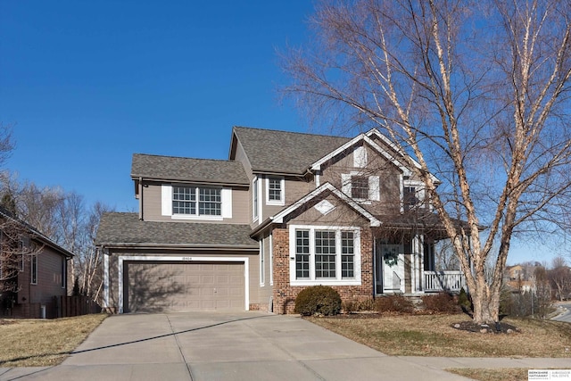 view of front of property featuring covered porch and a garage