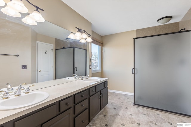 bathroom featuring a notable chandelier, walk in shower, and vanity