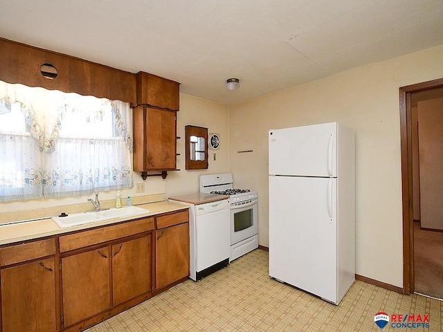 kitchen with white appliances and sink