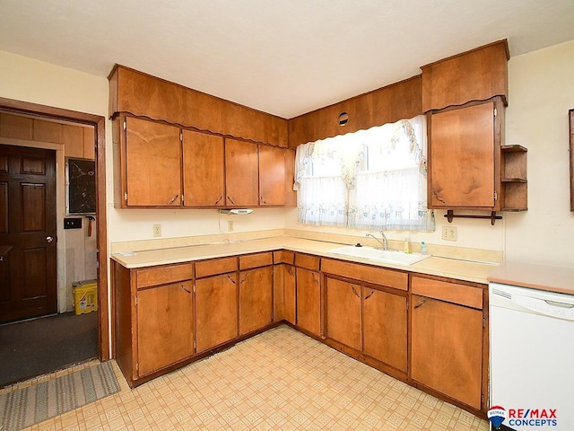 kitchen with white dishwasher and sink