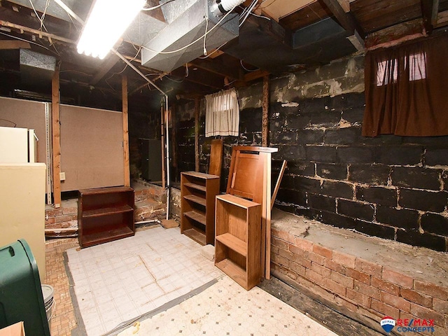 basement with refrigerator