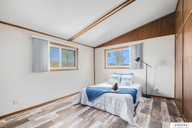 bedroom featuring vaulted ceiling and wood-type flooring