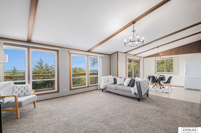 living room with an inviting chandelier, carpet floors, and vaulted ceiling with beams