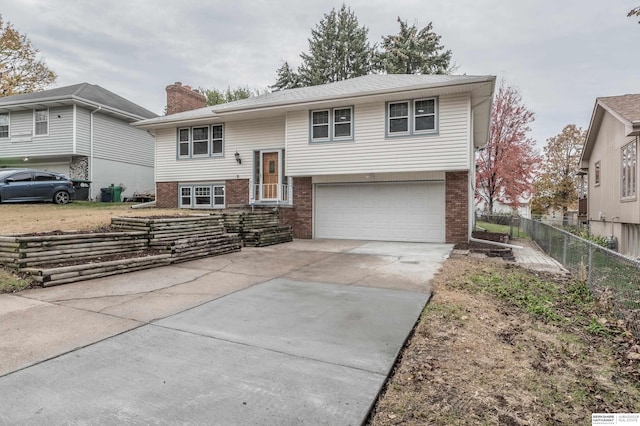 split foyer home featuring a garage