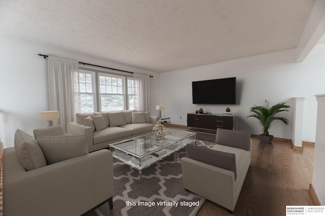 living room featuring a textured ceiling and dark wood-type flooring