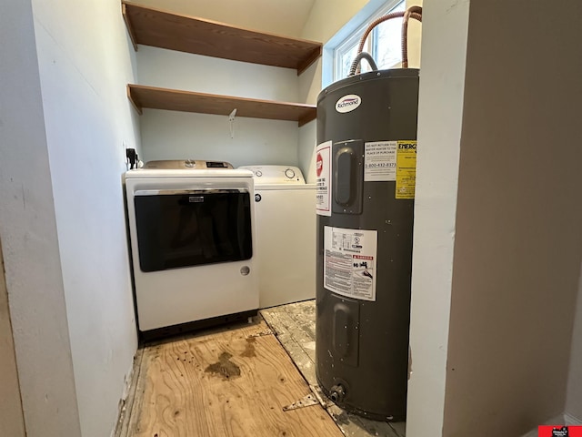 clothes washing area with washer and clothes dryer and electric water heater