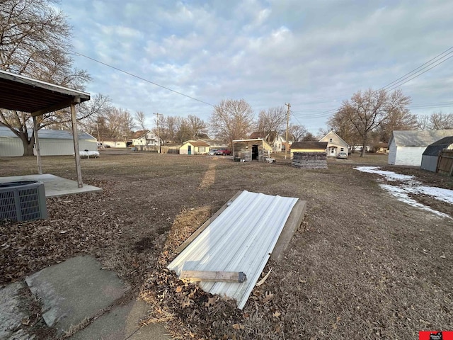 view of yard featuring central AC