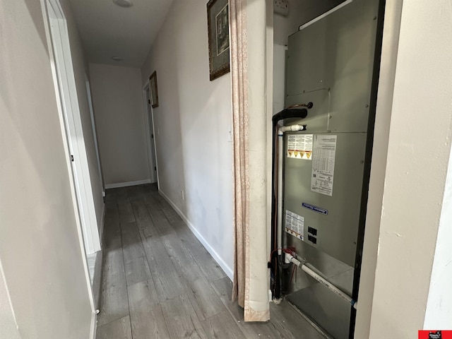 hallway featuring light hardwood / wood-style floors and heating unit