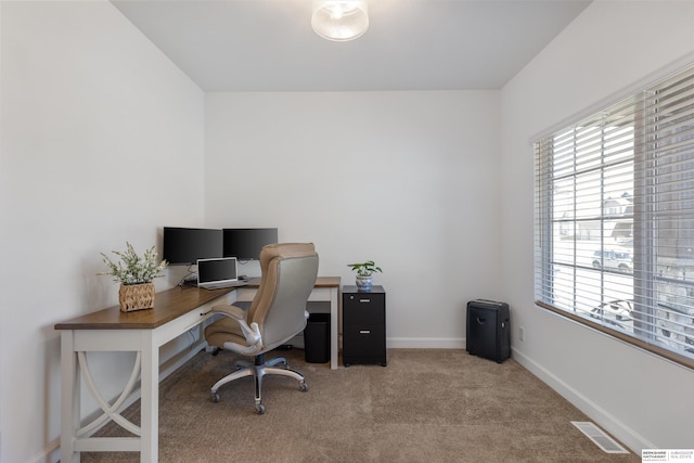 office area featuring light colored carpet