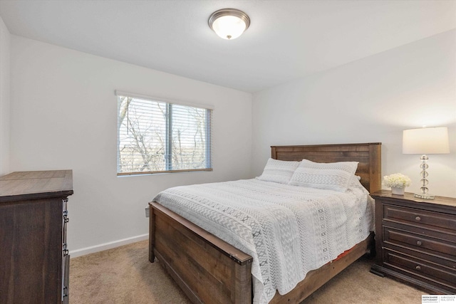 bedroom with light colored carpet