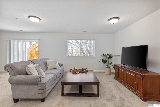 carpeted living room featuring a wealth of natural light