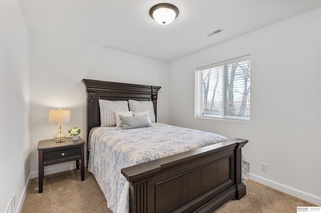 bedroom with light colored carpet