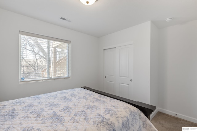 bedroom featuring a closet and carpet floors